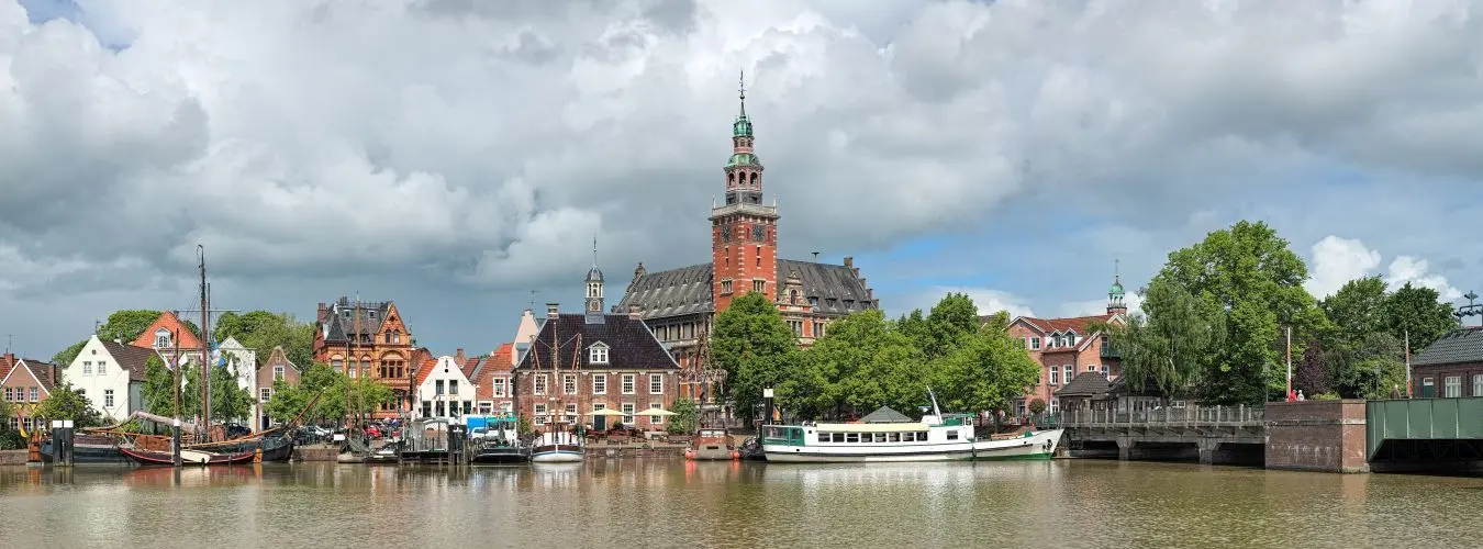 Panoramic view from Leda river on City Hall in Dutch Renaissance style, Old Weigh House in Dutch classical Baroque style, Tourist Harbor and Bridge of Erich vom ...