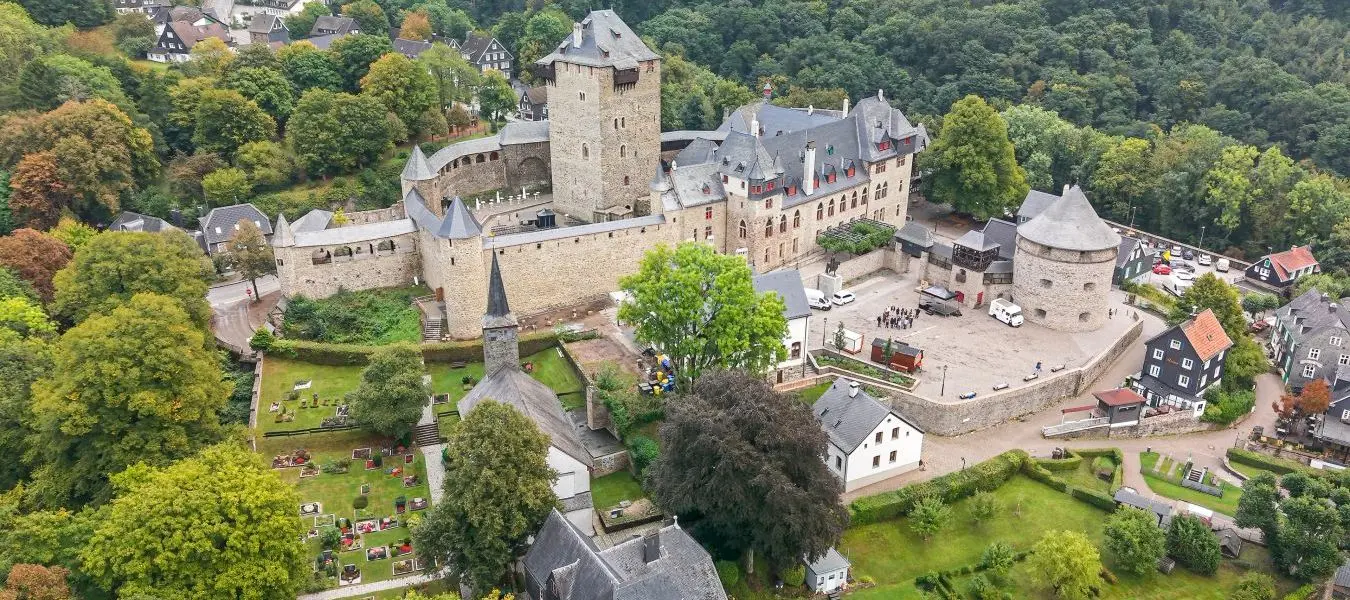 Castle Burg at Solingen region with a drone fly over during Autumn time window