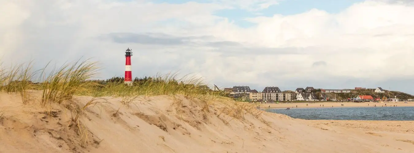 Dune, lighthouse and city of Hörnum at Sylt - Southern village at german north sea island