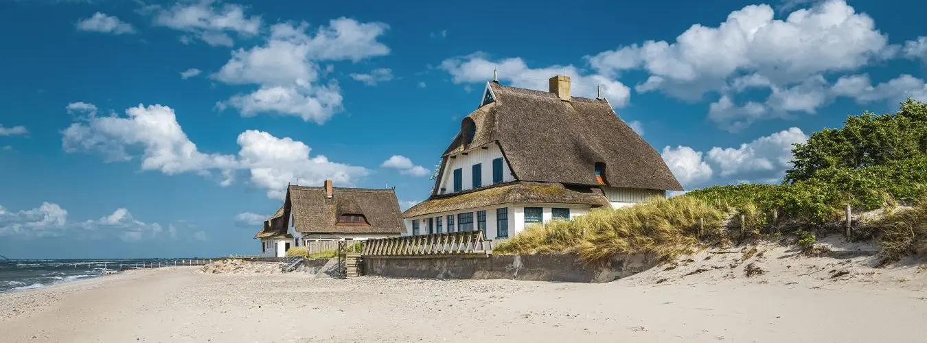 Thatched roof house on the coast
