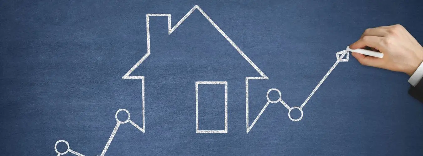 House painted with chalk on a blackboard with an ascending curve